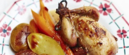 A plate of roast quail, potatoes and vegetables